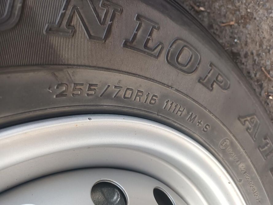 A Close Up of a Tire That Says Dunlop on It — South West 4WD Wreckers in Harristown, QLD