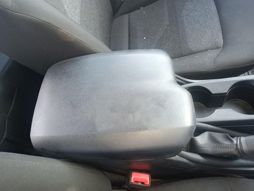 A Car Arm Rest with a Red Button on It — South West 4WD Wreckers in Harristown, QLD