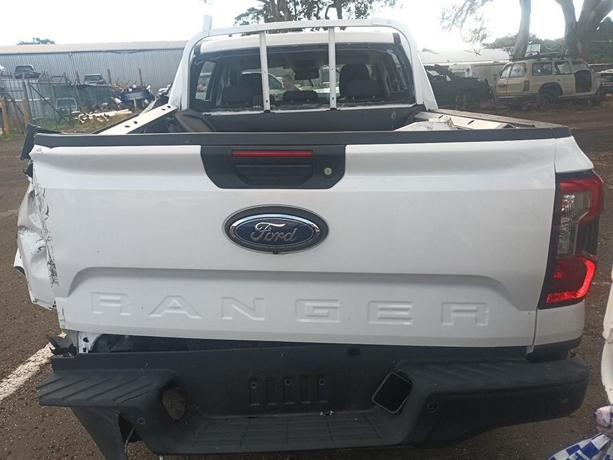 The Back End of a White Ford Ranger Truck is Damaged — South West 4WD Wreckers in Harristown, QLD