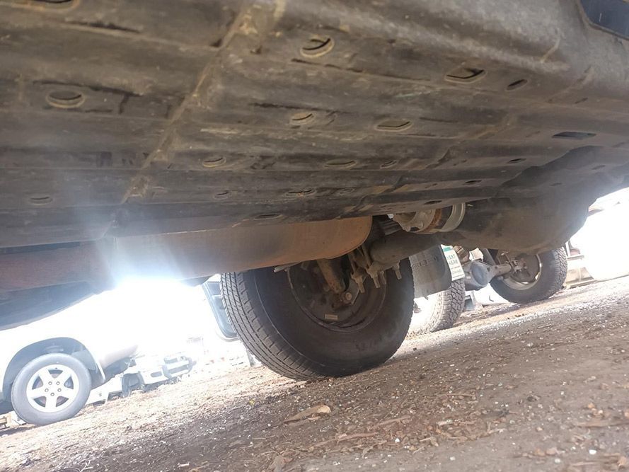 A Close Up of the Underside of a Car Parked on the Side of the Road — South West 4WD Wreckers in Harristown, QLD