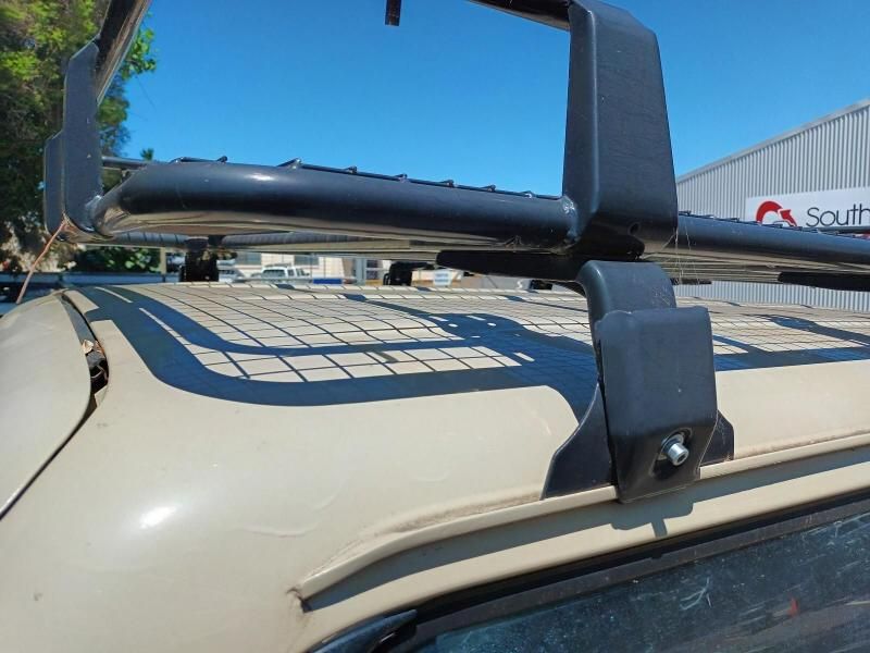 A Roof Rack is Attached to the Roof of a Car — South West 4WD Wreckers In Brisbane, QLD