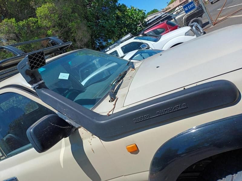 A Car With a Snorkel on the Hood is Parked in a Parking Lot — South West 4WD Wreckers In Brisbane, QLD