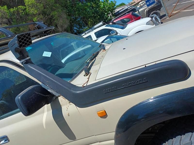 A Car With a Snorkel on the Hood is Parked in a Parking Lot — South West 4WD Wreckers In Brisbane, QLD
