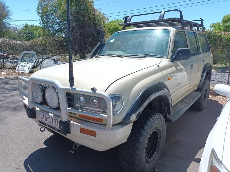 A Toyota Land Cruiser is Parked on the Side of the Road — South West 4WD Wreckers In Brisbane, QLD