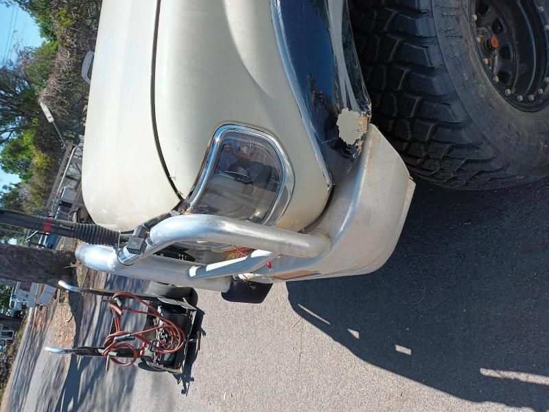 A White Truck is Parked on the Side of the Road — South West 4WD Wreckers In Brisbane, QLD