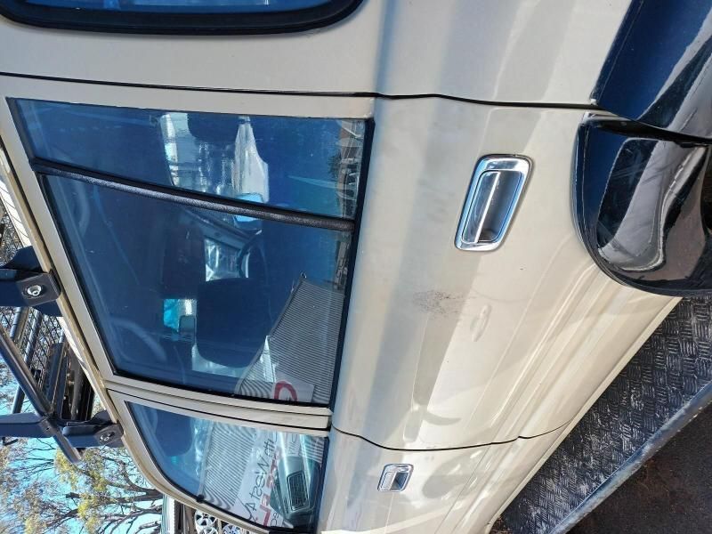 A White Car is Parked in the Snow With the Door Open — South West 4WD Wreckers In Brisbane, QLD