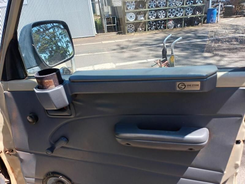 A Car Door With a Cup Holder and a Mirror— South West 4WD Wreckers In Brisbane, QLD