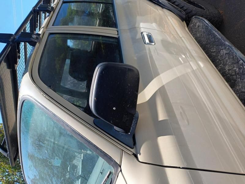 A White Truck is Parked on the Side of the Road — South West 4WD Wreckers In Brisbane, QLD