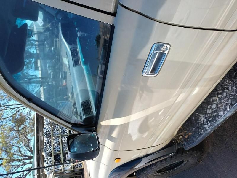A White Truck is Parked on the Side of the Road — South West 4WD Wreckers In Brisbane, QLD