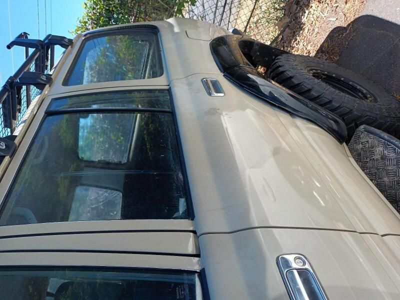 A Truck is Parked on the Side of the Road Next to a Tire — South West 4WD Wreckers In Brisbane, QLD