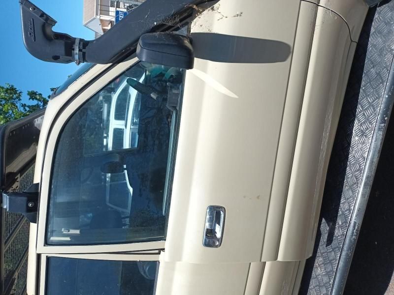 A White Truck is Parked on the Side of the Road — South West 4WD Wreckers In Brisbane, QLD