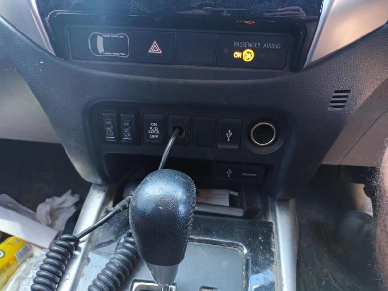 A Close Up of a Car Dashboard With a Walkie Talkie Plugged Into It — South West 4WD Wreckers In Brisbane, QLD