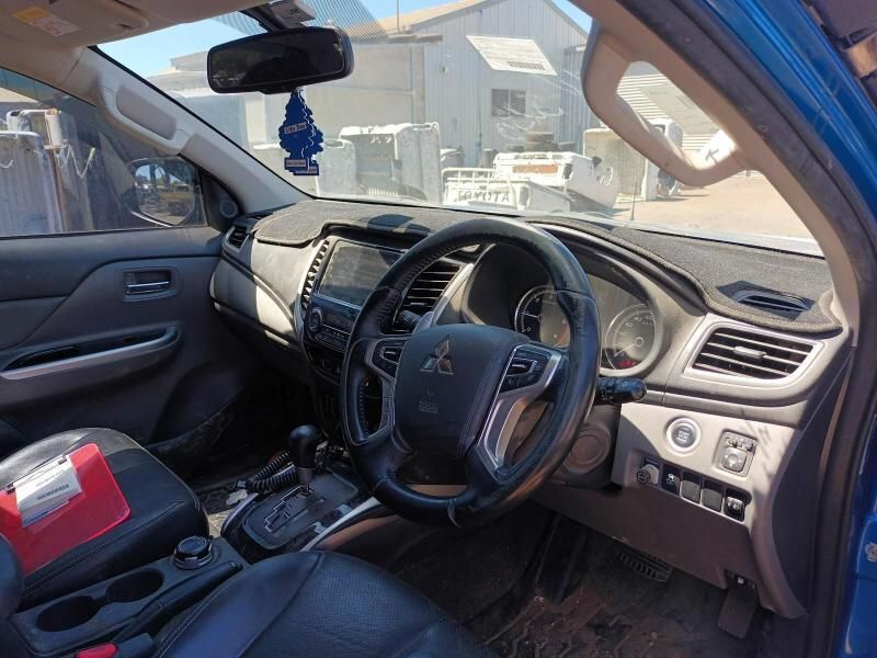 The Interior of a Blue Mitsubishi Triton is Shown — South West 4WD Wreckers In Brisbane, QLD