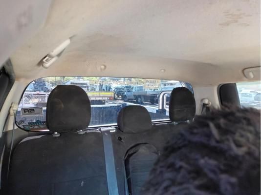 A Person is Sitting in the Back Seat of a Car — South West 4WD Wreckers In Brisbane, QLD