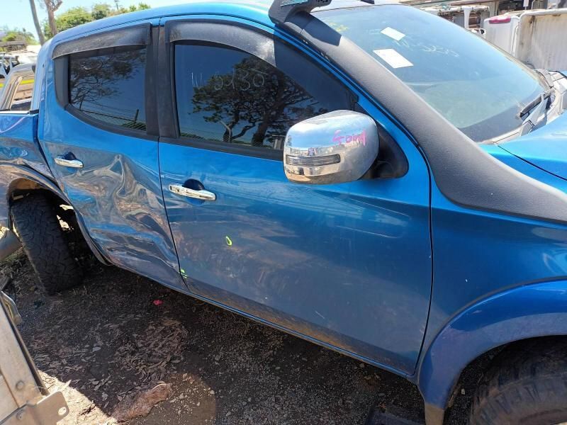 A Blue Truck is Parked on the Side of the Road — South West 4WD Wreckers In Brisbane, QLD