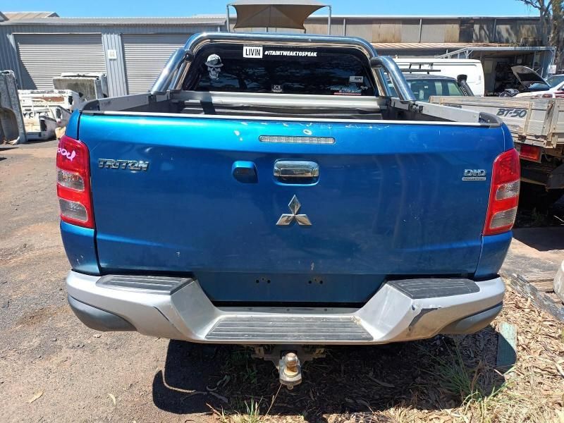 A  Mitsubishi Triton Truck is Parked in a Parking Lot — South West 4WD Wreckers In Brisbane, QLD