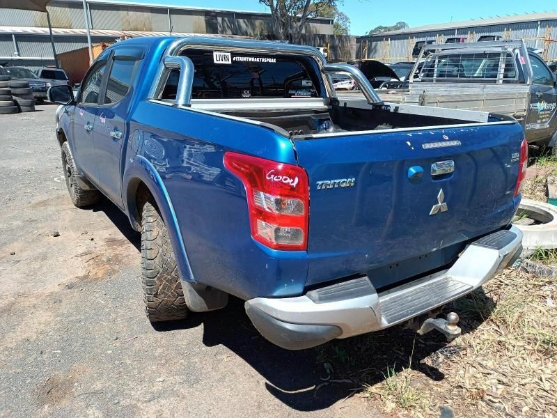 A Blue Mitsubishi Triton Pickup Truck is Parked — South West 4WD Wreckers In Brisbane, QLD