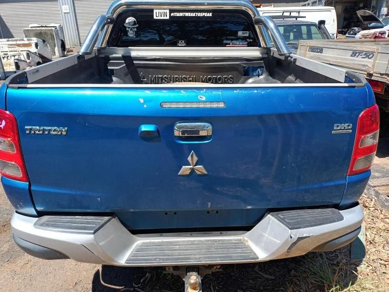 The Back End of a Blue Mitsubishi Triton Truck is Shown — South West 4WD Wreckers In Brisbane, QLD