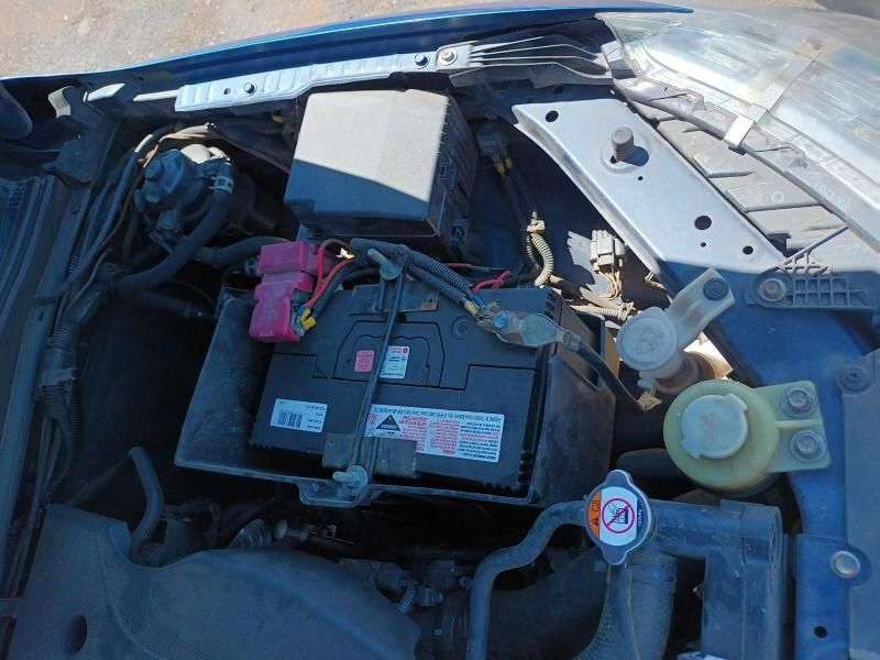 The Hood of a Car With a Battery in It — South West 4WD Wreckers In Brisbane, QLD