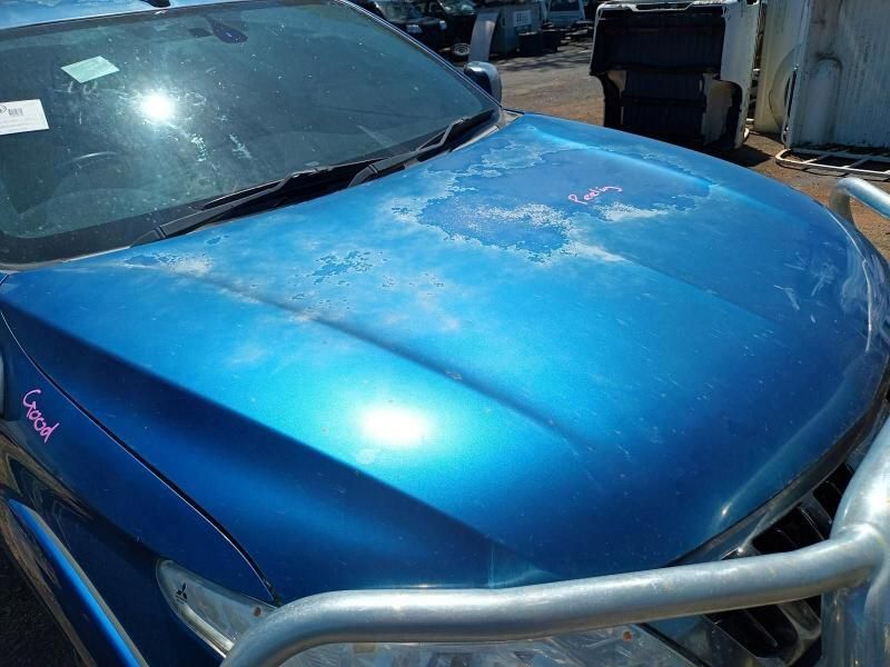 A Blue Car With a Hood That Has Been Damaged — South West 4WD Wreckers In Brisbane, QLD