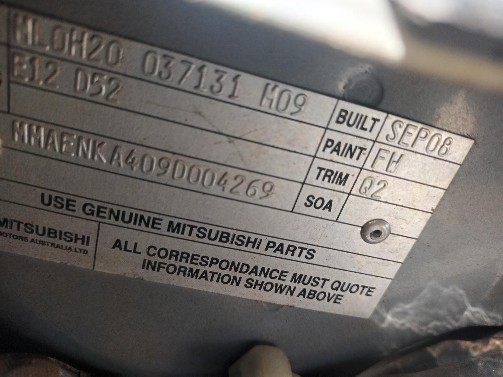 A Close Up of a Mitsubishi Parts Label on a Car — South West 4WD Wreckers In Brisbane, QLD