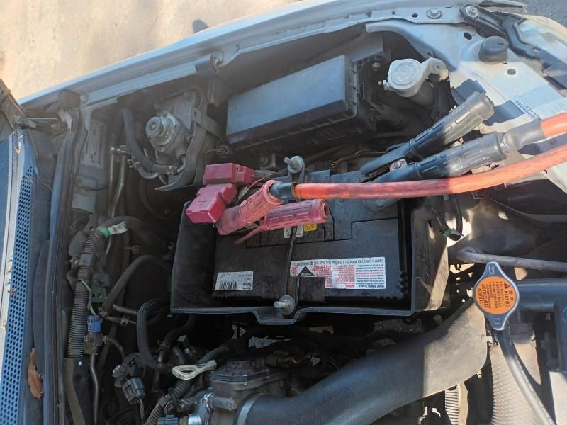 A Close Up of a Car Engine With a Battery in It — South West 4WD Wreckers In Brisbane, QLD
