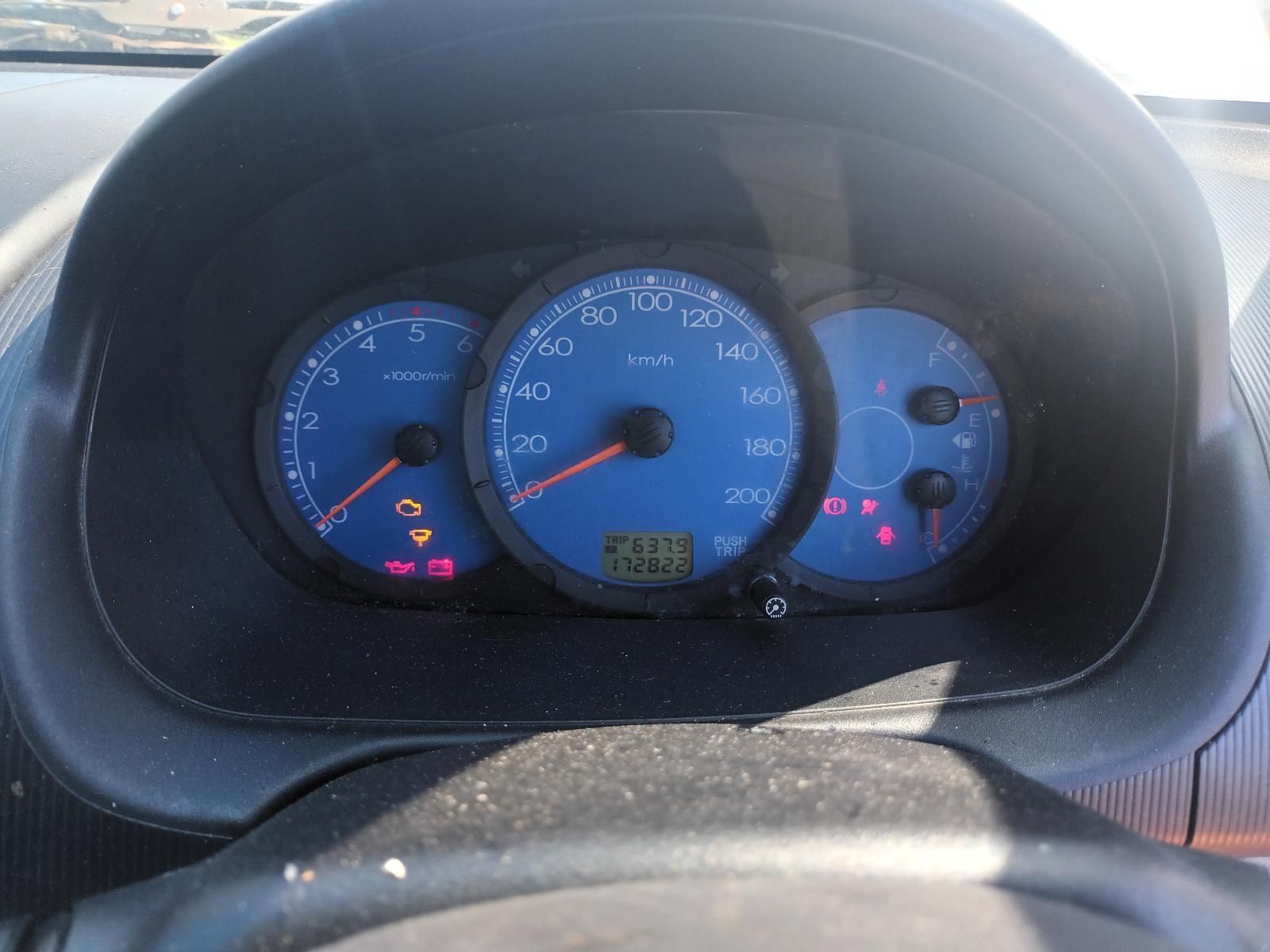 A Close Up of a Car Dashboard With a Blue Speedometer — South West 4WD Wreckers In Brisbane, QLD