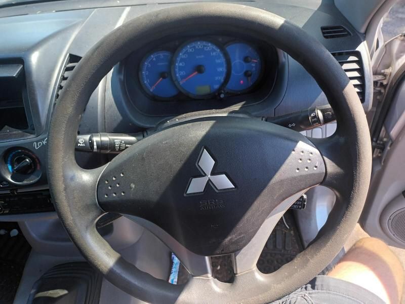 A Steering Wheel With a Mitsubishi Logo on It — South West 4WD Wreckers In Brisbane, QLD