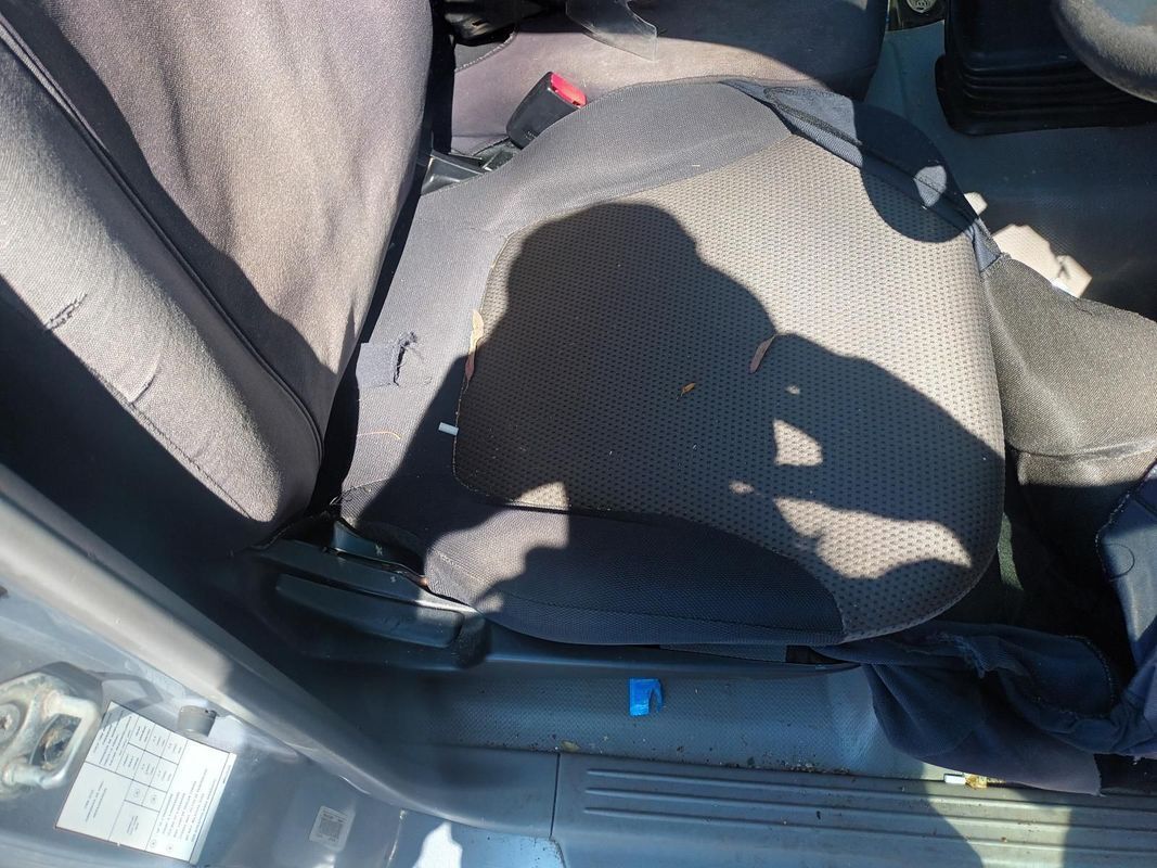 A Shadow of a Person is Cast on the Seat of a Car — South West 4WD Wreckers In Brisbane, QLD