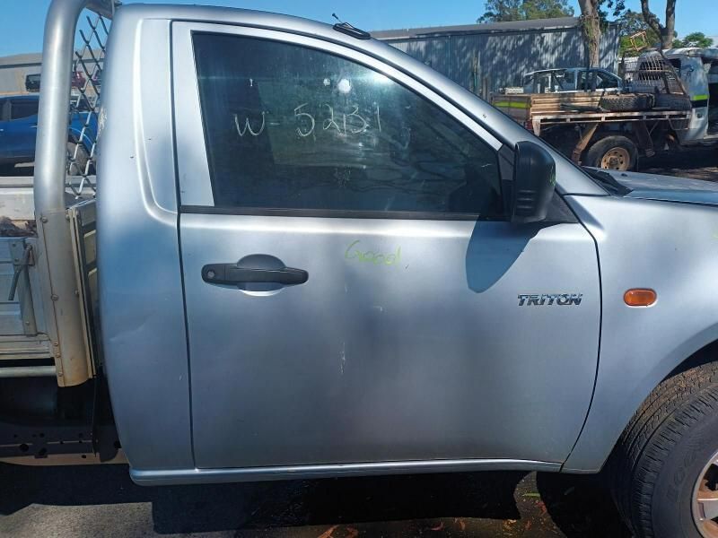 A Silver Truck With a Broken Door is Parked in a Parking Lot — South West 4WD Wreckers In Brisbane, QLD
