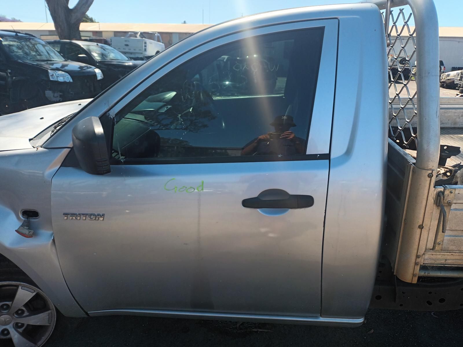 A Silver Truck With the Word Titan on the Door — South West 4WD Wreckers In Brisbane, QLD