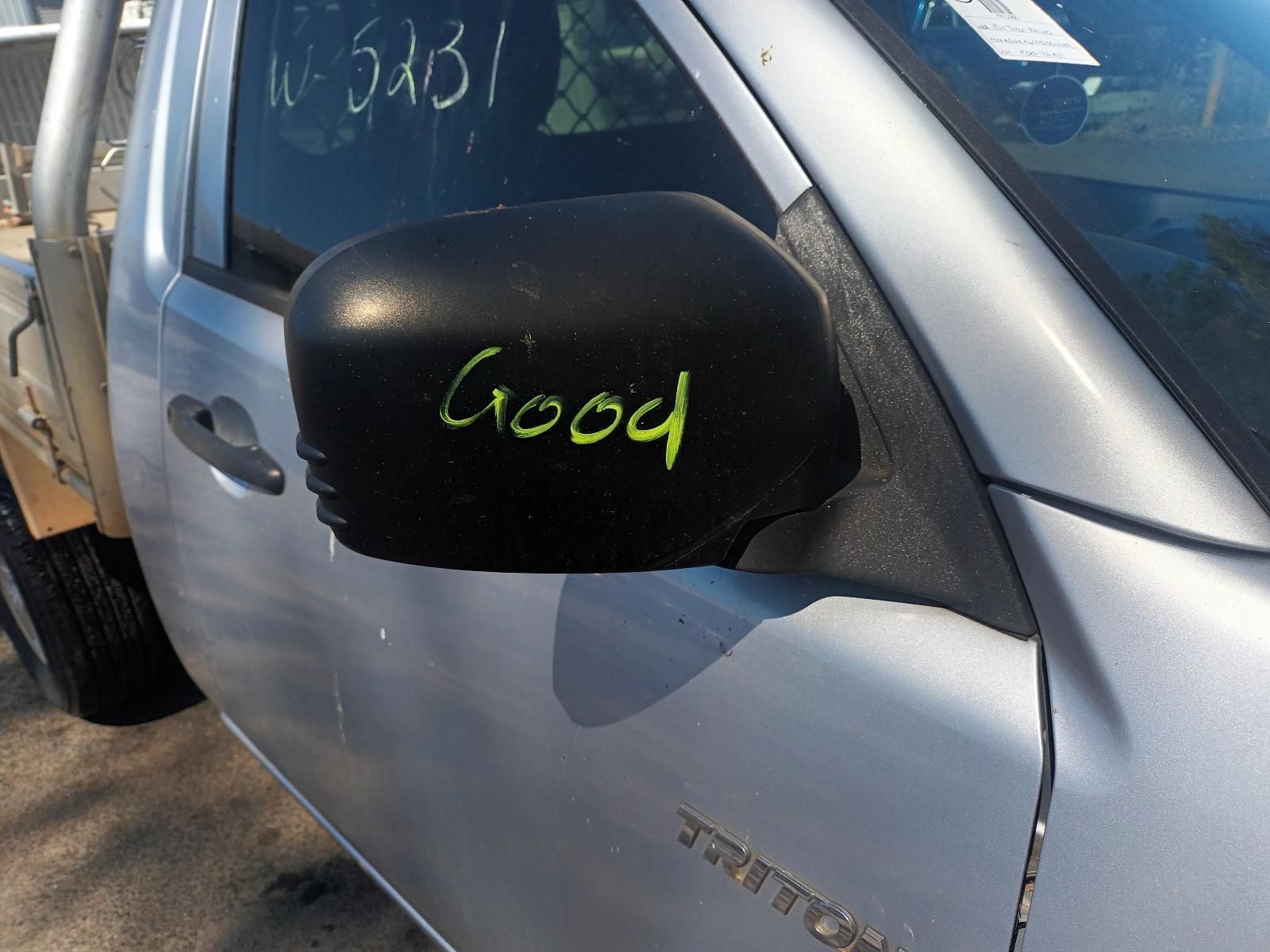 A Silver Truck With the Word Good Written on the Side Mirror — South West 4WD Wreckers In Brisbane, QLD