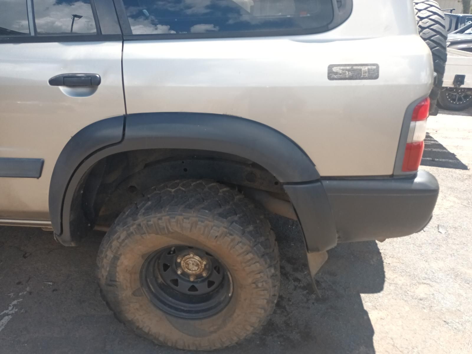 A Silver SUV is Parked on the Side of the Road — South West 4WD Wreckers In Brisbane, QLD