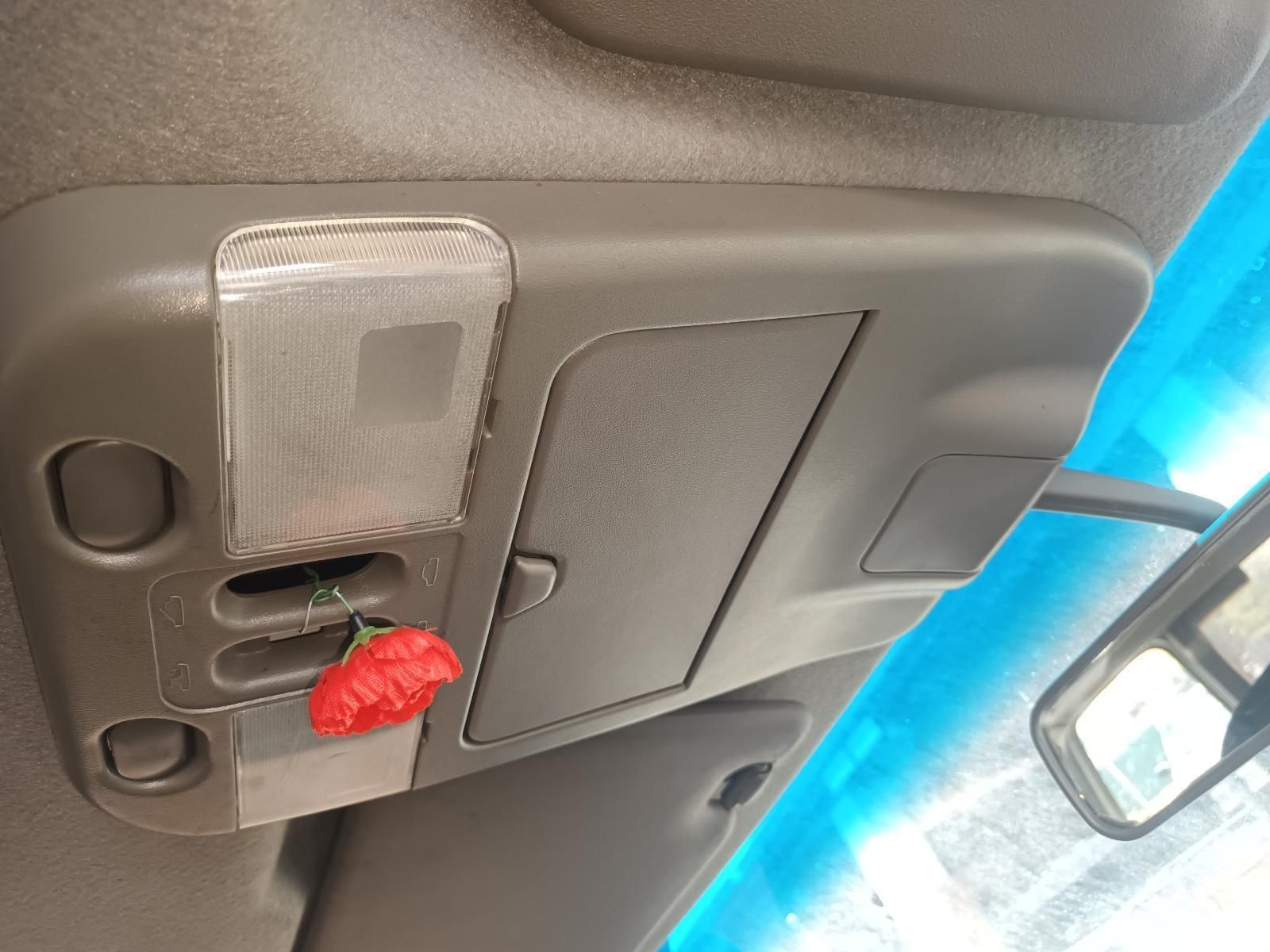 A Red Flower is Hanging from the Ceiling of a Car — South West 4WD Wreckers In Brisbane, QLD