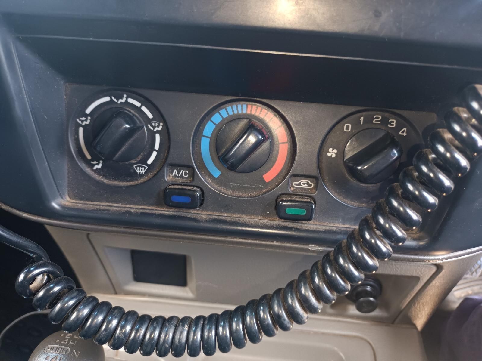 A Phone Cord is Hanging from the Dashboard of a Car — South West 4WD Wreckers In Brisbane, QLD
