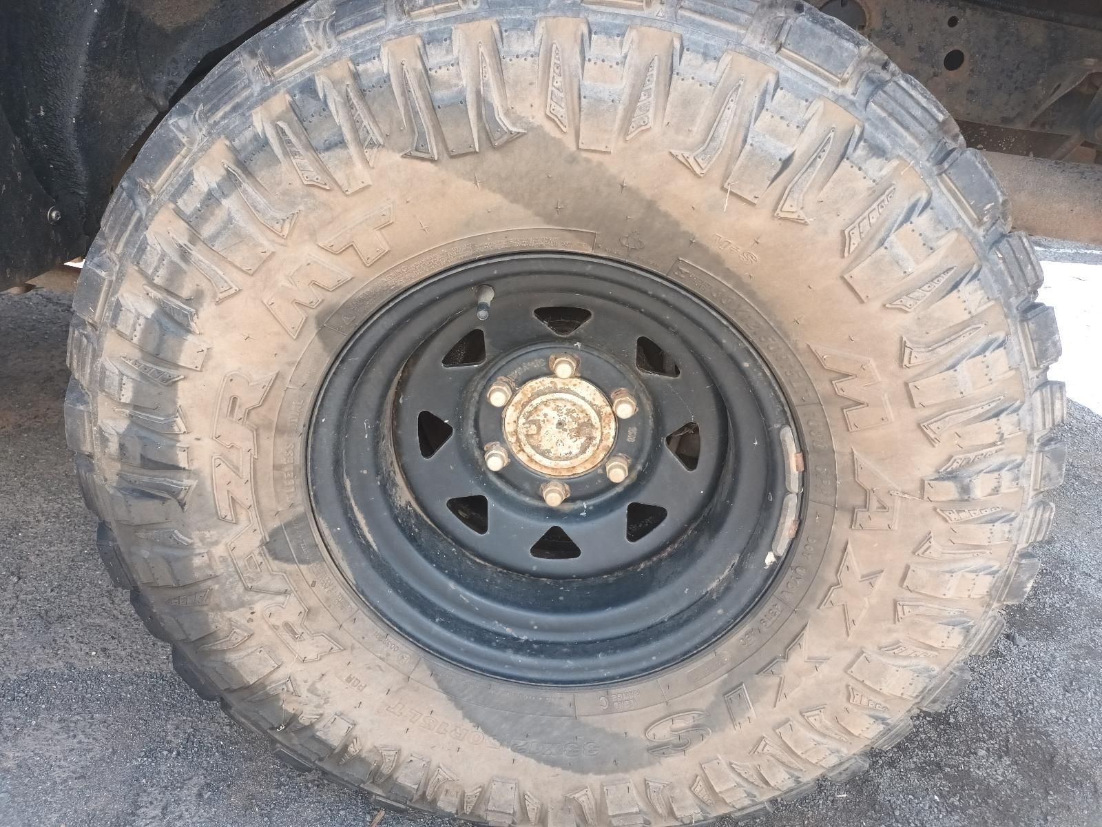 A Close Up of a Mud Covered Tire on a Truck — South West 4WD Wreckers In Brisbane, QLD