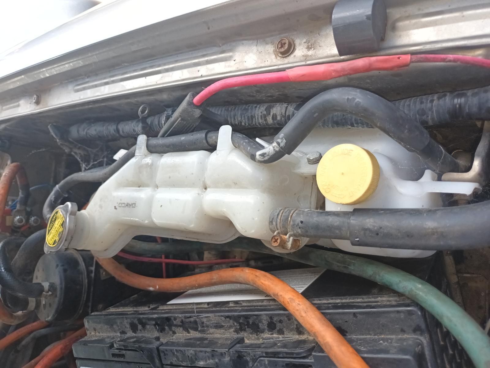 A Close Up of a Car Engine with a Yellow Cap — South West 4WD Wreckers In Brisbane, QLD