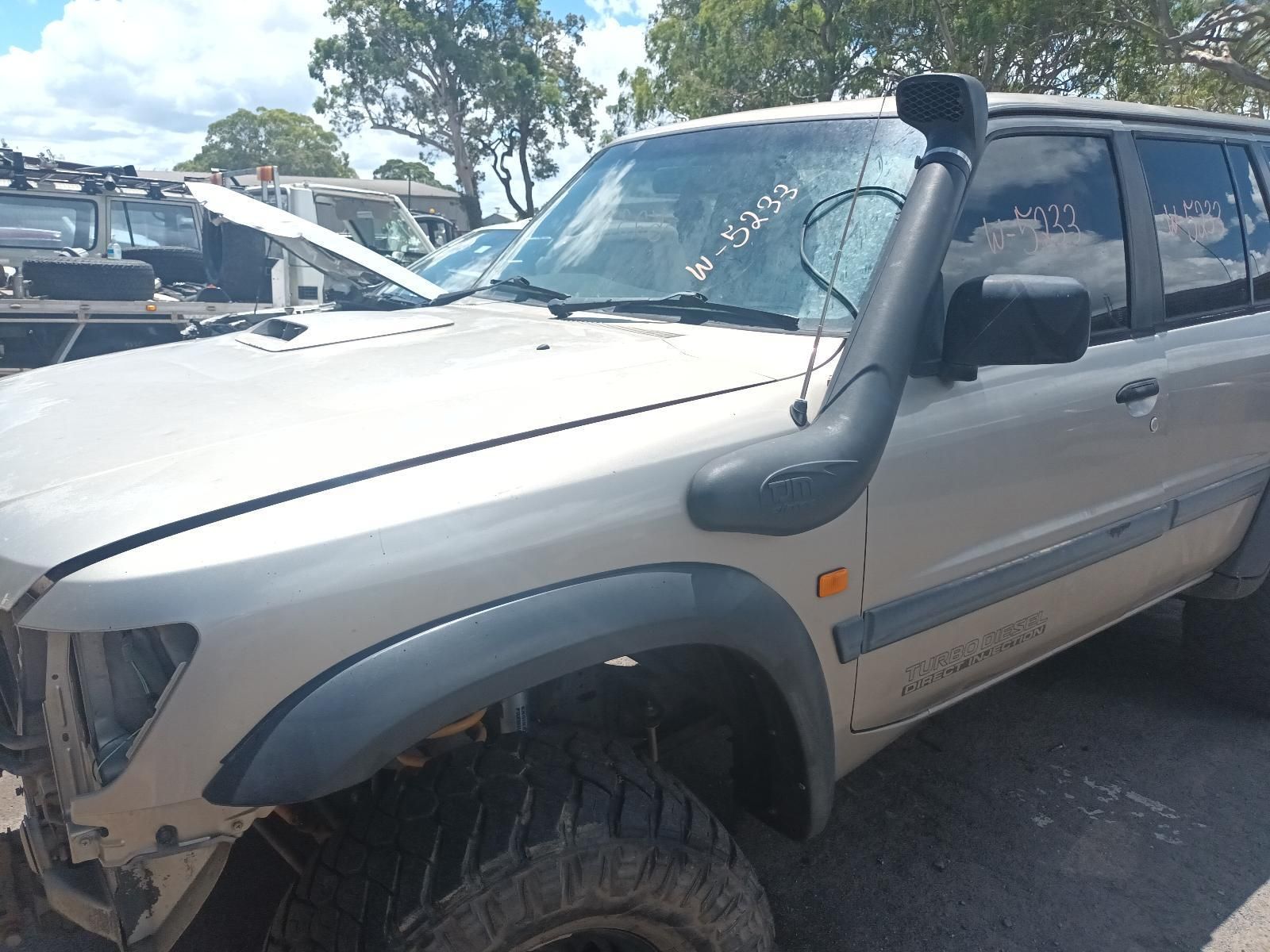 A Toyota Land Cruiser with a Snorkel is Parked in a Lot — South West 4WD Wreckers In Brisbane, QLD