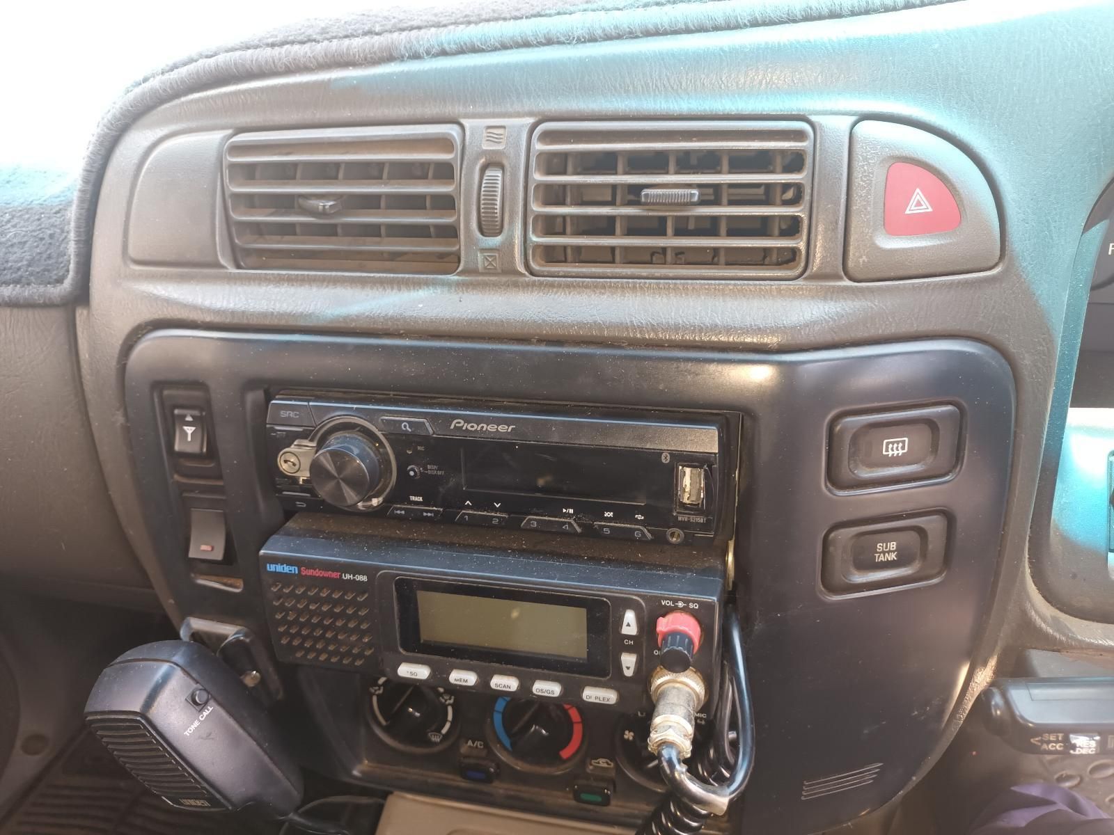 The Dashboard of a Car with a Radio and a Microphone — South West 4WD Wreckers In Brisbane, QLD