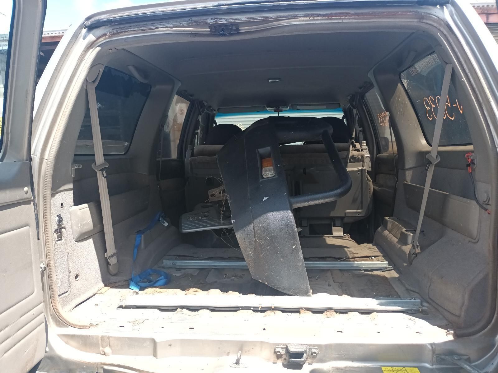 The Back of a Car with the Door Open and a Chair in the Back — South West 4WD Wreckers In Brisbane, QLD