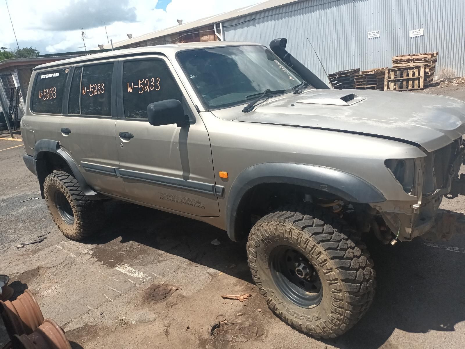 A Toyota Land Cruiser is Parked in a Parking Lot — South West 4WD Wreckers In Brisbane, QLD