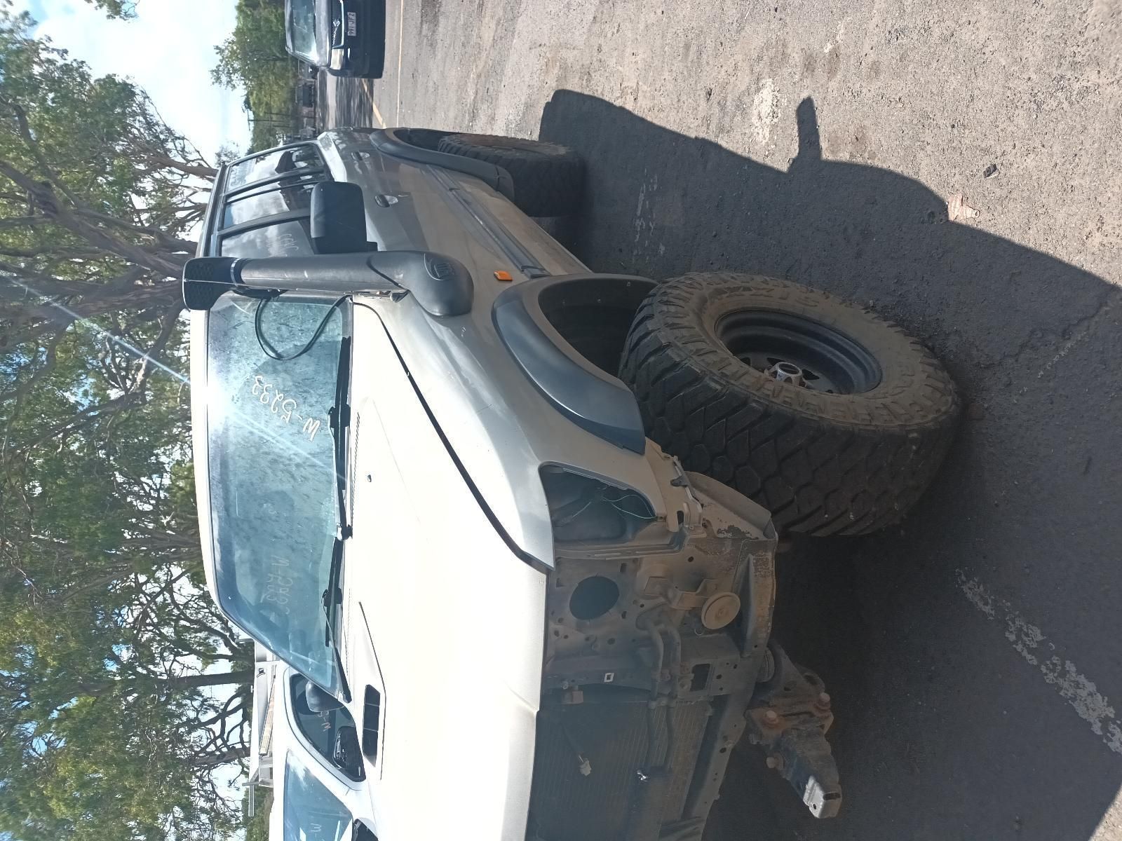 A White Truck is Parked on the Side of the Road — South West 4WD Wreckers In Brisbane, QLD