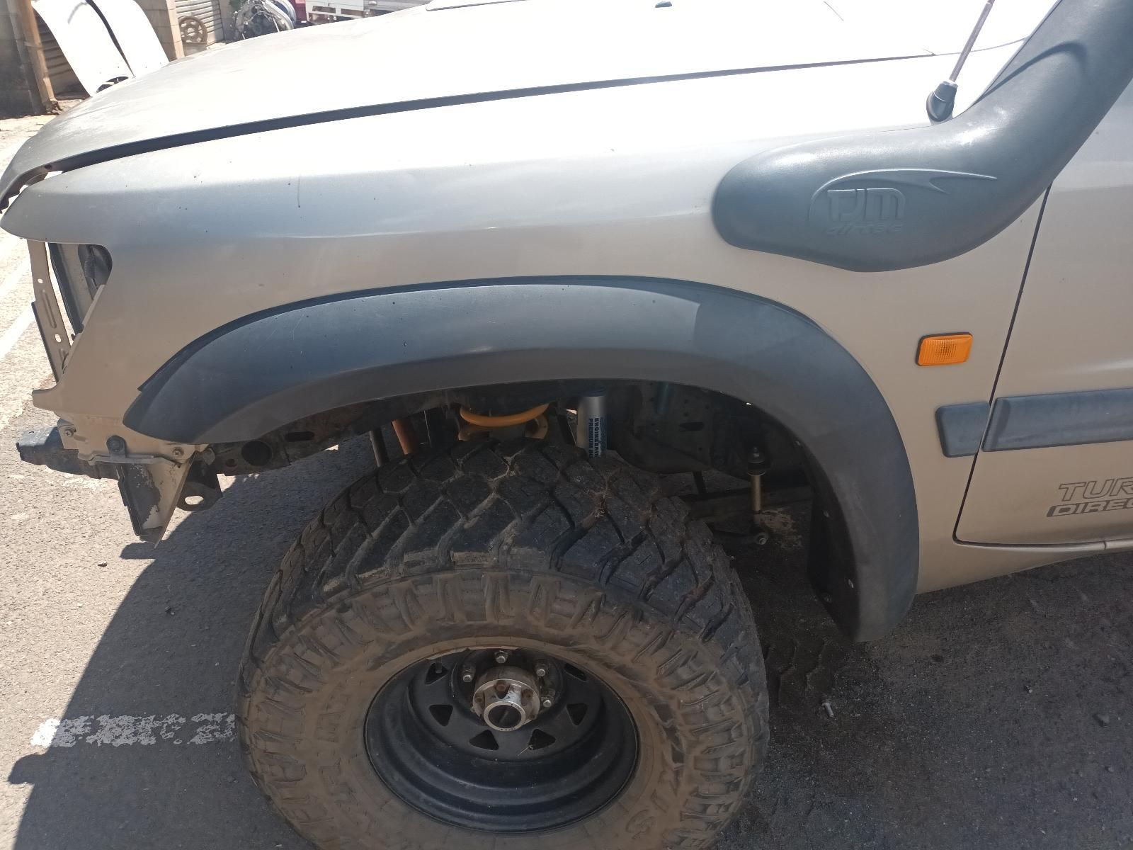 A Jeep with a Snorkel is Parked on the Side of the Road — South West 4WD Wreckers In Brisbane, QLD