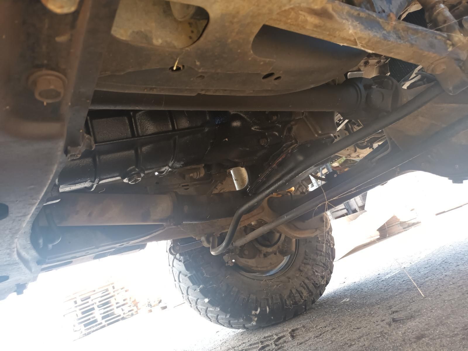 A Close Up of the Underside of a Truck with a Large Tire — South West 4WD Wreckers In Brisbane, QLD