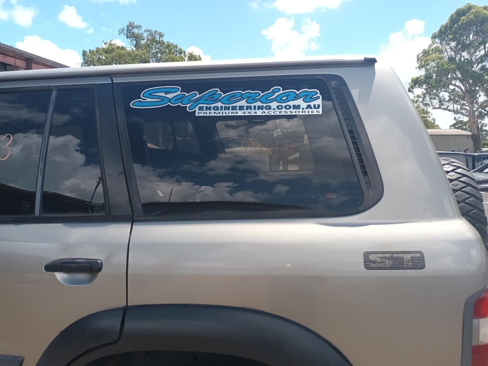 A Silver SUV with a Sticker on the Back Window — South West 4WD Wreckers In Brisbane, QLD