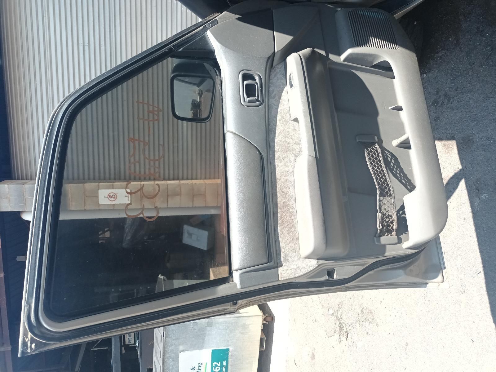 A Car Door is Open and Sitting in Front of a Building — South West 4WD Wreckers In Brisbane, QLD