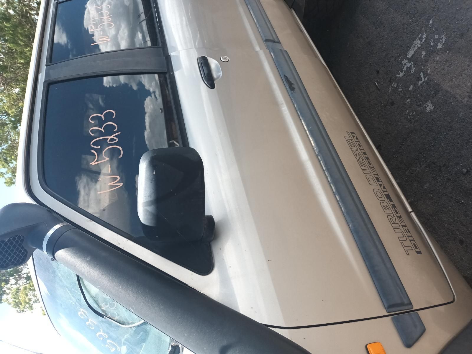 A White Car with a Words Written on the Door — South West 4WD Wreckers In Brisbane, QLD