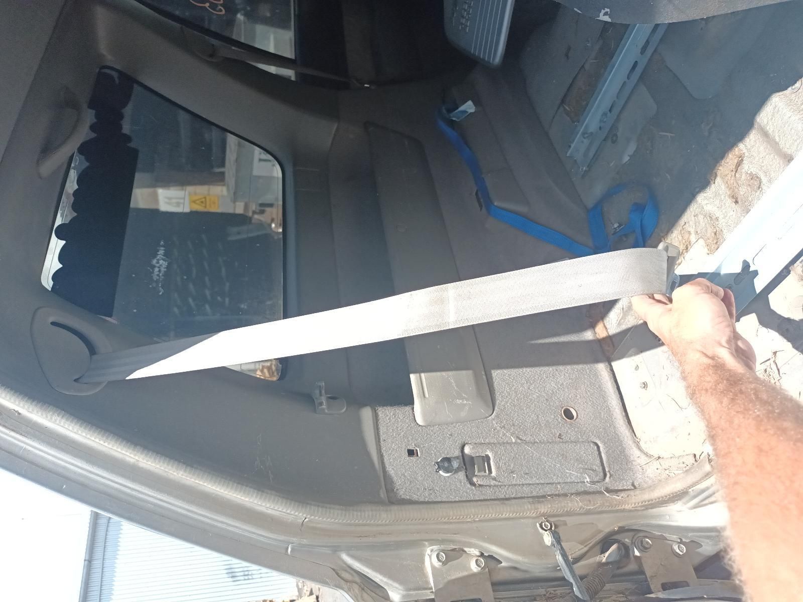 A Person is Holding a Seat Belt in a Car — South West 4WD Wreckers In Brisbane, QLD