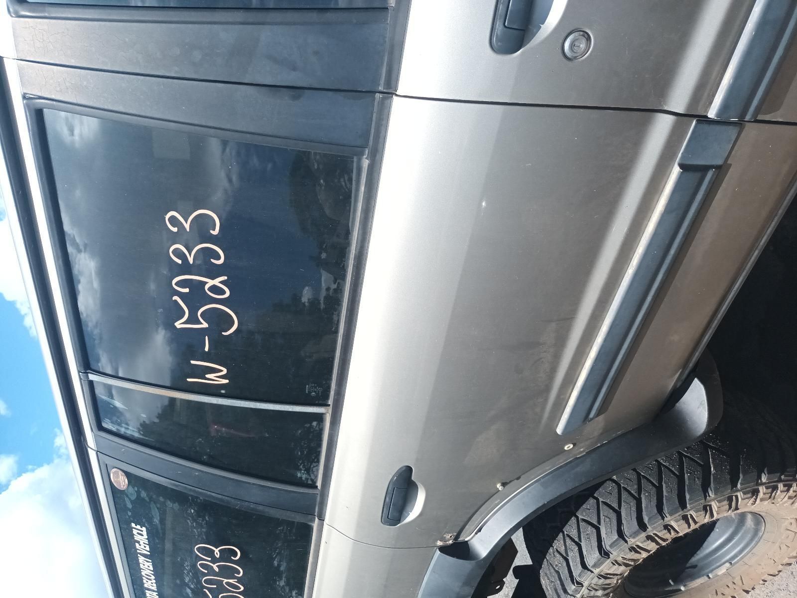 A Silver Car with a License Plate Written on Side — South West 4WD Wreckers In Brisbane, QLD