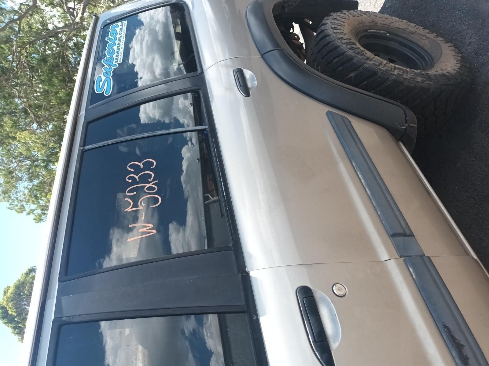 A Silver SUV with a Words Written on the Side — South West 4WD Wreckers In Brisbane, QLD